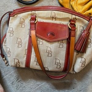 Canvas Signature Dooney and Bourke purse.  Red trim with tan